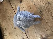 A grey woollen sheep about 25cms long (quite porky!)