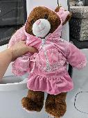 Found brown build a bear/bunny wearing hot pink hoodie and ruffle skirt. 