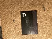 A6 notebook, black with grey edge along the spine.