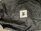 I’ve lost a fawn padded coat with hat incorporated with scarf in a black carrier