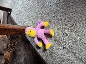 Small monkey in pink and yellow approx 20cms ht
