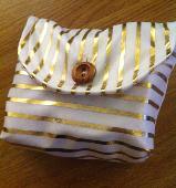 Lost: makeup bag Cream and gold striped material, wooden button. Homemade (no br