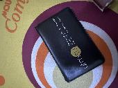 black cardholder with university of toronto written on it. holds my important ca