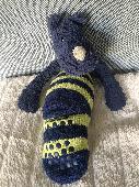 Well-loved 12 year old blue jellycat bashful rhino with a white horn, wearing a 